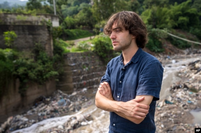 Boyan Slat, the creator of The Ocean Cleanup project, stands along the Las Vacas river in Chinautla, near Guatemala City, Wednesday, June 8, 2022. (AP Photo/Moises Castillo)