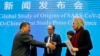 FILE: Marion Koopmans (R) and Peter Ben Embarek (C), of the World Health Organization team say farewell to their Chinese counterpart Liang Wannian, (L), after a WHO-China Joint Study Press Conference at the end of the WHO mission in Wuhan, China, Feb 9, 2021.