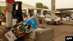 Uprooted petrol pumps lie in the forecourt of a Total petrol station after an anti-French protest in N'Djamena, Chad, on May 14, 2022. On Monday, six opposition leaders arrested after the protests were handed one-year suspended sentences for disturbing public order. 