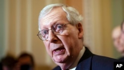 Senate Minority Leader Mitch McConnell, R-Ky., speaks with reporters following a closed-door policy lunch at the Capitol in Washington, May 24, 2022.