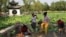 People and children enjoy themselves by the lakeside at a park during the Dragon Boat festival holiday, following the COVID-19 outbreak in Beijing, China, June 4, 2022.