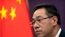 Gao Feng, spokesman for China's Ministry of Commerce, speaks during a late-night press conference about a China-Europe investment deal at the Ministry of Commerce in Beijing, Dec. 30, 2020.