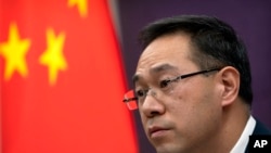 Gao Feng, spokesman for China's Ministry of Commerce, speaks during a late-night press conference about a China-Europe investment deal at the Ministry of Commerce in Beijing, Dec. 30, 2020.