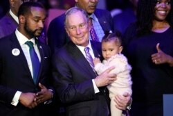 FILE - Democratic presidential candidate Michael Bloomberg is introduced by Houston Mayor Sylvester Turner during his campaign launch of "Mike for Black America," at the Buffalo Soldiers National Museum, Feb. 13, 2020, in Houston.