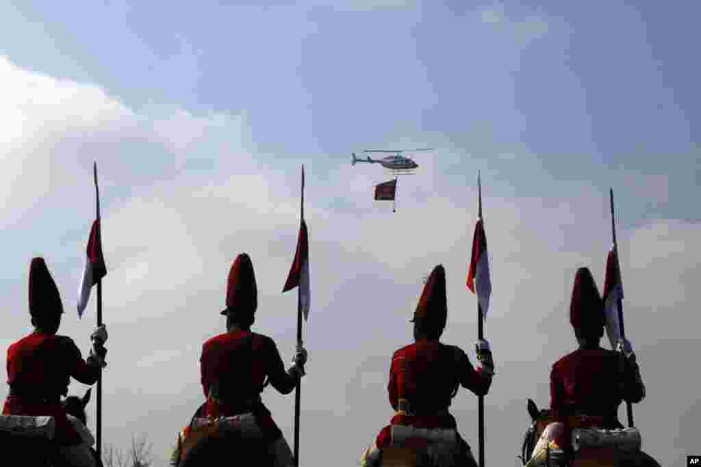 Nepalese army soldiers participate in a parade to mark Constitution Day in Kathmandu, Nepal.