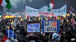 FILE -- In this Jan. 21, 2012 photo thousands of people proceed towards the parliament building on Andrassy Street during the "Peace March for Hungary", a demonstration organized in support of the center-right Hungarian government in Budapest, Hungary.