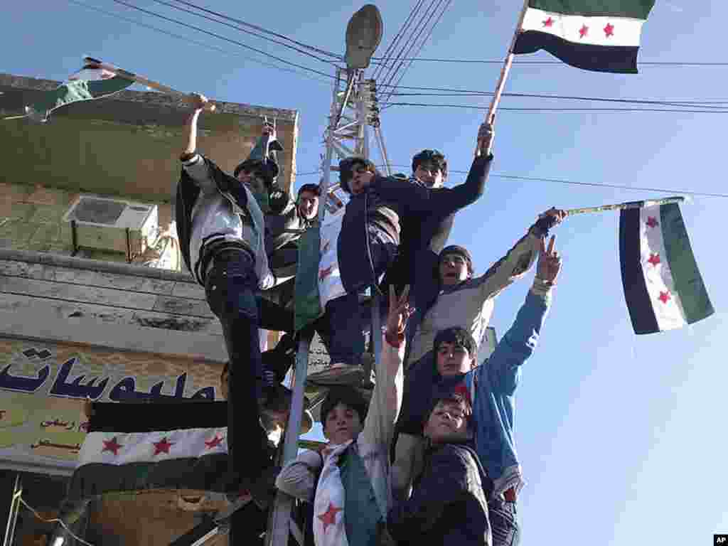 Syrians protest against President Bashar al-Assad in Kafranbel near Idlib, February 21, 2012. (Reuters)