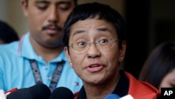 Rappler CEO and executive editor Maria Ressa talks to reporters after posting bail at the Pasig Regional Trial Court, metropolitan Manila, Philippines, March 29, 2019.