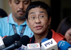 Rappler CEO and executive editor Maria Ressa talks to reporters after posting bail at the Pasig Regional Trial Court, Manila, March 29, 2019.