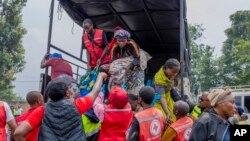 People who crossed from Congo disembark a truck in Gyseny, Rwanda, Jan. 28, 2025, following M23 rebels' advances into eastern Congo's capital Goma.