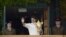 Roger Federer of Switzerland holds the winners trophy on the clubhouse balcony after defeating Andy Murray of Britain in their men's singles final tennis match at the Wimbledon Tennis Championships in London, July 8, 2012.