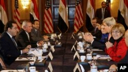 U.S. Secretary of State John Kerry, second from right, meets with members of Egyptian political parties including Ayman Nour, left, in Egypt, March 2, 2013.