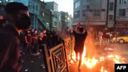 A picture obtained by AFP outside Iran on Sept. 21, 2022, shows Iranian demonstrators taking to the streets of Tehran during a protest for Mahsa Amini, days after she died in police custody.