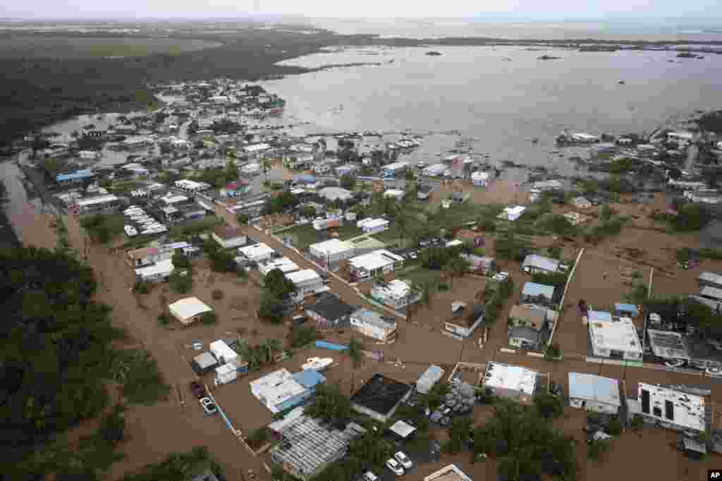Homes are flooded on Salinas Beach after the passing of Hurricane Fiona in Salinas, Puerto Rico, Sept. 19, 2022. 