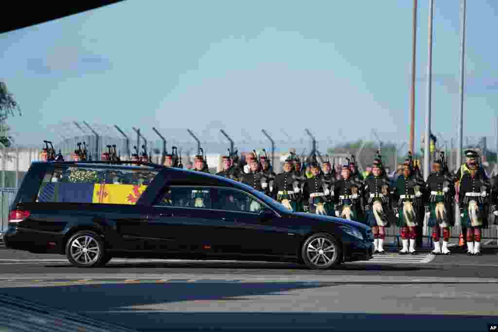 The coffin of Queen Elizabeth II arrives at Edinburgh Airport, Sept. 13, 2022, for the final journey from Scotland in a Royal Air Force plane to London.