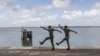 Two members of the Senegalese Armed Forces march during a ceremony for the 20th anniversary of the capsizing of "Le Joola" in Ziguinchor. The ferry, which sank between Dakar and Ziguinchor, left 1,863 dead, according to the official report.
