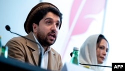 Ahmad Massoud, leader of the National Resistance Front of Afghanistan, and Aliya Yilmaz, Afghan women's rights activist, speak to journalists at Concordia Press Club, on the occasion of the intra-Afghanistan conference, in Vienna, Austria, Sept. 16, 2022.