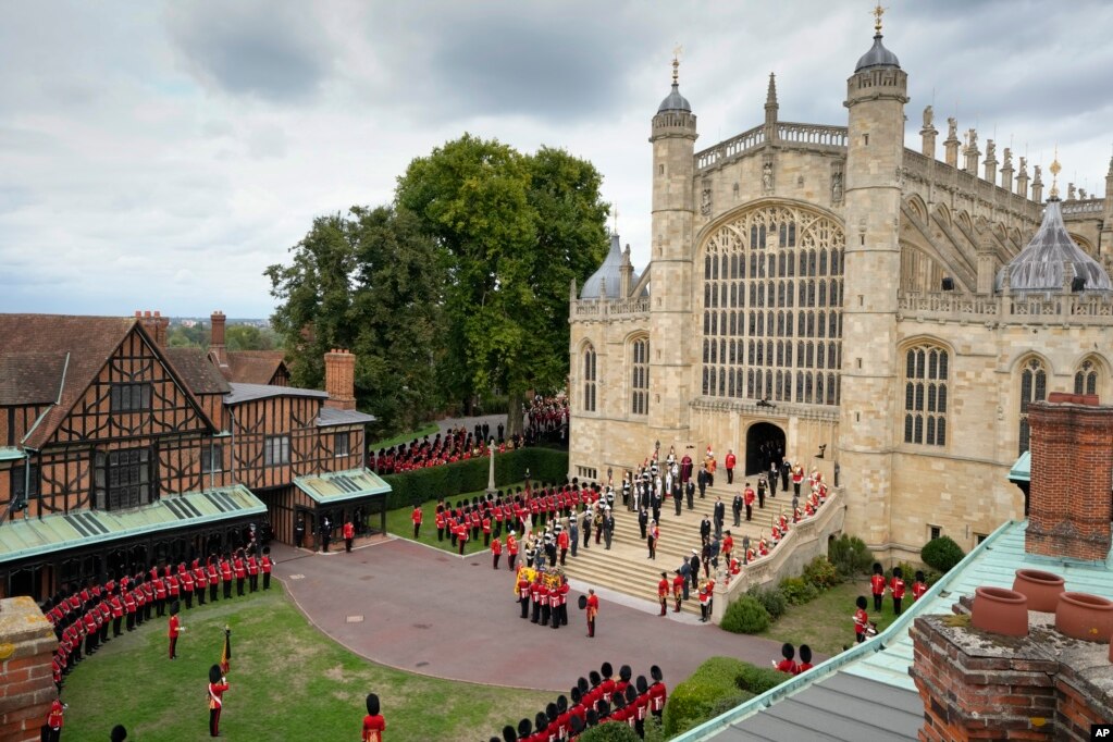 The coffin of Queen Elizabeth is carried into St. George's Chapel for her funeral at Windsor Castle, Sept. 19, 2022.