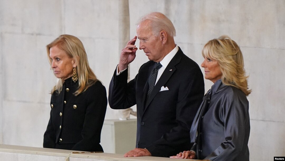 President Joe Biden and first lady Jill Biden (right) view the coffin of Queen Elizabeth II, lying in state on the catafalque in Westminster Hall in London, Sept. 18, 2022.