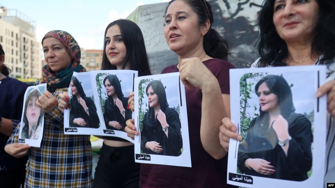 FILE - Kurdish and Lebanese women take part in a rally in Beirut, Sept. 21, 2022, days after the Iranian authorities announced the death of Mahsa Amini, who had been held in Tehran for allegedly wearing a hijab in an "improper" way.