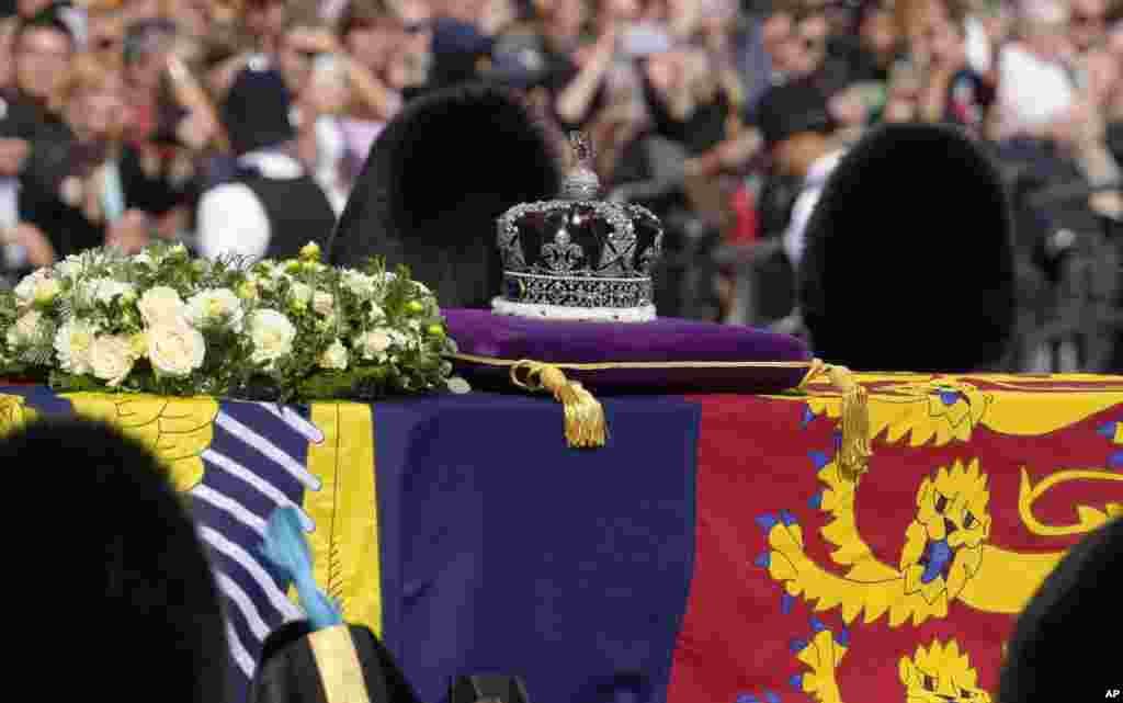 Grenadier Guards flank the coffin of Queen Elizabeth II during a procession from Buckingham Palace to Westminster Hall in London, Sept. 14, 2022. 