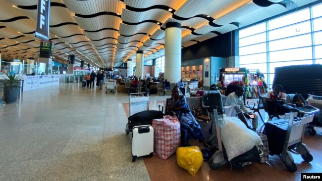 Passengers wait at the Blaise Diagne International Airport in Dakar, Senegal Sept. 24, 2022.