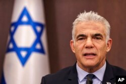 FILE - Israel's Prime Minister Yair Lapid attends a weekly cabinet meeting in Jerusalem, Sept. 18, 2022.