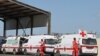 Lebanese Red Cross vehicles are parked at the Lebanese-Syrian border crossing in Arida, Lebanon Sept. 23, 2022.