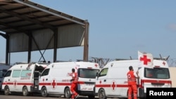 Lebanese Red Cross vehicles are parked at the Lebanese-Syrian border crossing in Arida, Lebanon Sept. 23, 2022.