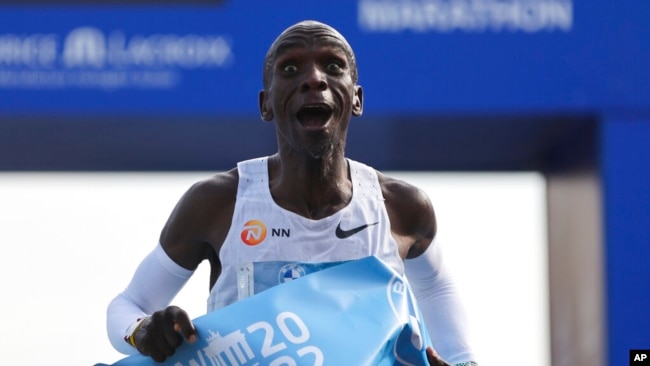 FILE - Kenya's Eliud Kipchoge crosses the line to win the Berlin Marathon in Berlin, Germany, Sept. 25, 2022.