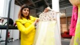Indian fashion designer Neha Poorswani show a creation, part of the 'We Are Made in Italy' fashion event, during the women's Spring Summer 2023 fashion week, in Milan, Italy, Sept. 21, 2022.