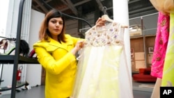 Indian fashion designer Neha Poorswani show a creation, part of the 'We Are Made in Italy' fashion event, during the women's Spring Summer 2023 fashion week, in Milan, Italy, Sept. 21, 2022.