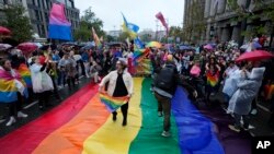 People take part in the European LGBTQ pride march in Belgrade, Serbia, Sept. 17, 2022. 