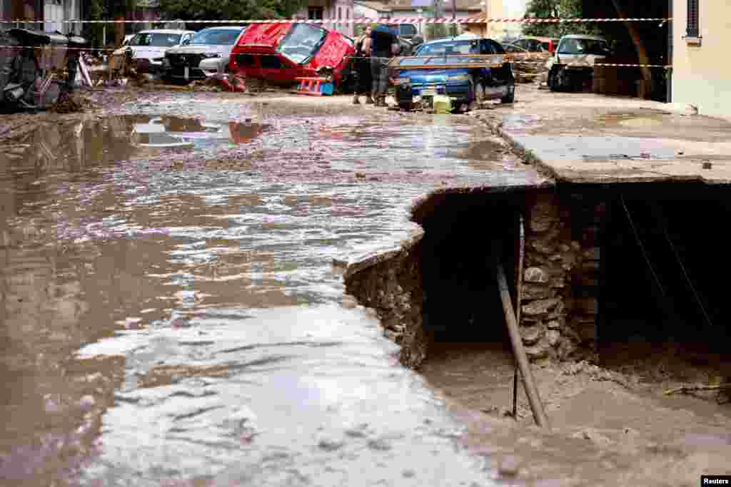 Water flows into a chasm after heavy rains and deadly floods hit the central Italian region of Marche, in Cantiano, Italy.