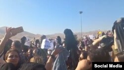A screenshot of video circulating on social media purports to show women in Saqez, Iran, removing their headscarves in protest against the death of 22-year-old Mahsa Amini, who died after being detained by morality police enforcing strict hijab rules.