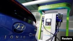 FILE - A Hyundai Motor's electric car IONIQ is charged at a electric charging station in Seoul, South Korea, Dec. 11, 2018. 