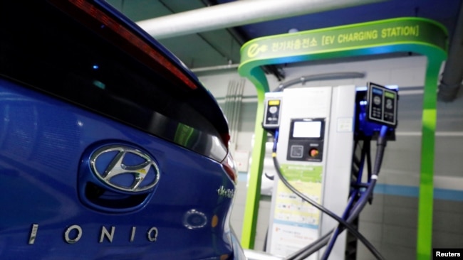 FILE - A Hyundai Motor's electric car IONIQ is charged at a electric charging station in Seoul, South Korea, Dec. 11, 2018. 