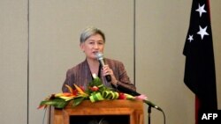 FILE - Australia's Foreign Minister Penny Wong speaks to the media after arriving in Port Moresby, Papua New Guinea, on Aug. 29, 2022.