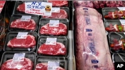 FILE - Beef is shown in the meat department at Lambert's Rainbow Market in Westwood, Mass. Mark Hamrick of Bankrate.com, says, 'The state of the economy is something that affects everyone,' but it's hard to gauge the impact of Federal Reserve Board decisions.