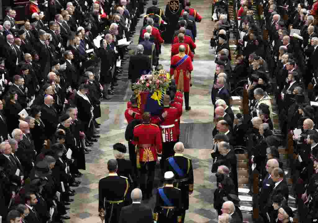 King Charles III, Camilla, the Queen Consort, Princess Anne, and her husband Vice Admiral Tim Laurence and Prince Andrew follow the coffin of Queen Elizabeth is being carried into Westminster Abbey for her funeral in central London, Sept. 19, 2022.