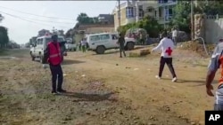 In this image made from video, medics attend the scene of an airstrike in Mekele, capital of the Tigray region of northern Ethiopia, Sept. 14, 2022. 