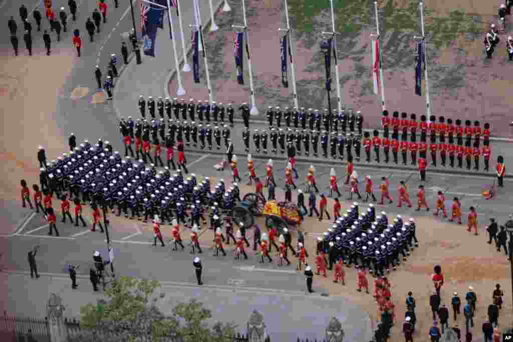 Members of the armed forces march during the funeral procession for Queen Elizabeth II in London, Sept. 19, 2022.