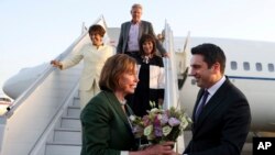 Head of Armenian National Assembly Alen Simonyan, right, welcomes U.S. House of Representatives Speaker Nancy Pelosi upon her arrival at the International Airport outside of Yerevan, Armenia, Sept. 17, 2022. (Photolure photo via AP)