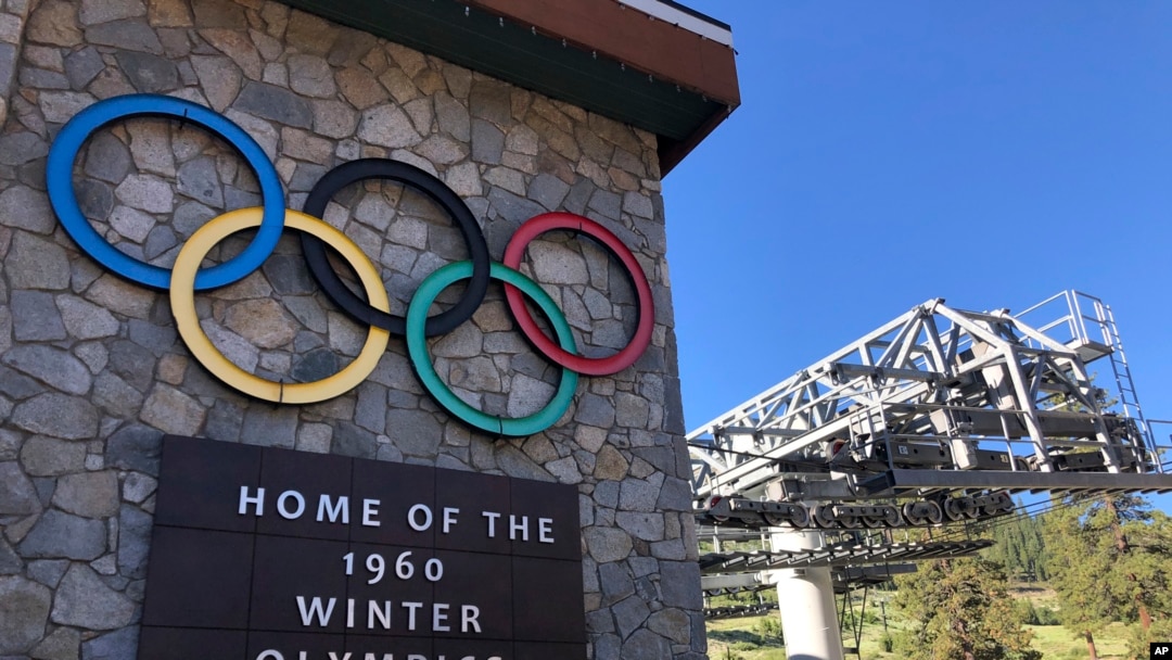 FILE - A sign marking the 1960 Winter Olympics is seen by a chairlift at what was then called Squaw Valley Ski Resort, July 9, 2020, in Olympic Valley, Calif.