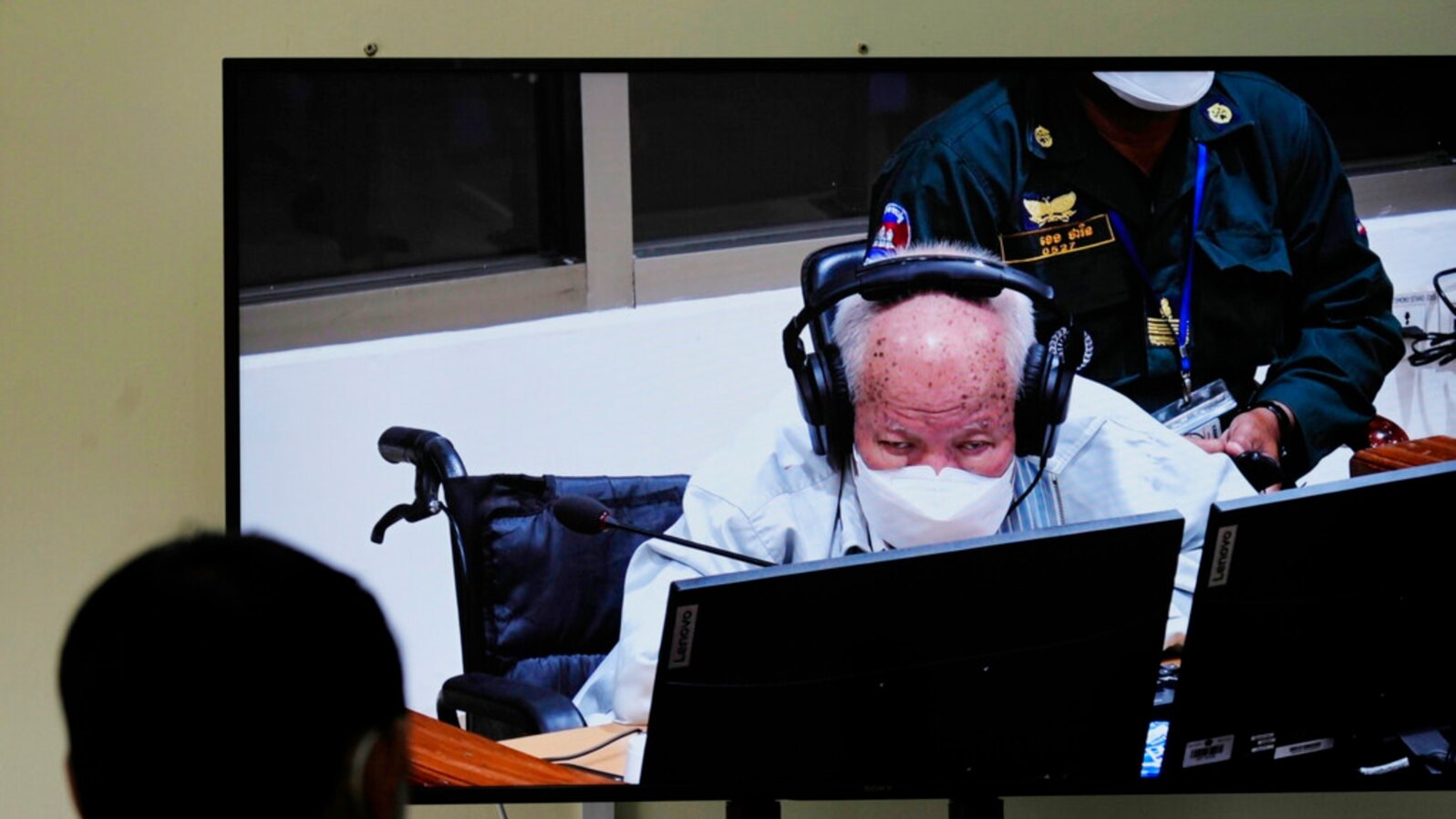 Khieu Samphan, former Khmer Rouge head of state, is seen on screen during his verdict announcement at the U.N.-backed war crimes tribunal in Phnom Penh, Cambodia, Sept. 22, 2022. 
