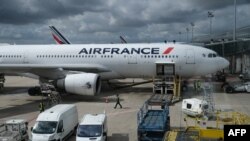 FILE: An Air France plane is seen on the tarmac at Charles de Gaulle airport in Roissy-en-France, on Sept. 8, 2022. The ban on short domestic flights does not affect Air France's global operations. 