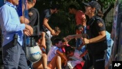 FILE - People are detained during the LGBTQ Pride March in Ankara, Turkey, July 5, 2022.