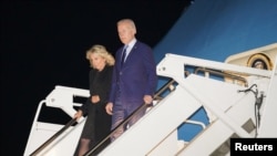 U.S. President Joe Biden and first lady Jill Biden step from Air Force One upon arrival at Stansted Airport to attend Monday’s funeral of Britain's Queen Elizabeth in London, Britain, Sept. 17, 2022.