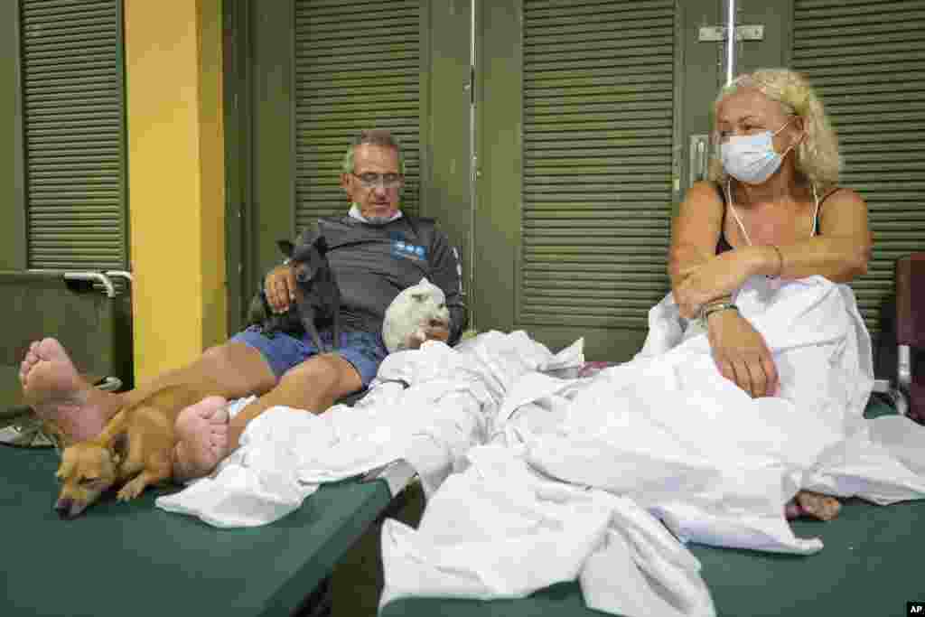 Residents affected by Hurricane Fiona rest at a school being used as a storm shelter in Salinas, Puerto Rico, Sept. 19, 2022. 