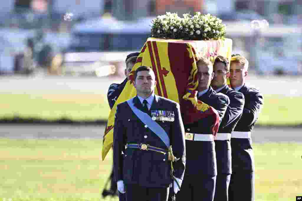 The coffin of Queen Elizabeth II is carried to the RAF aircraft at Edinburgh Airport, Sept. 13, 2022.